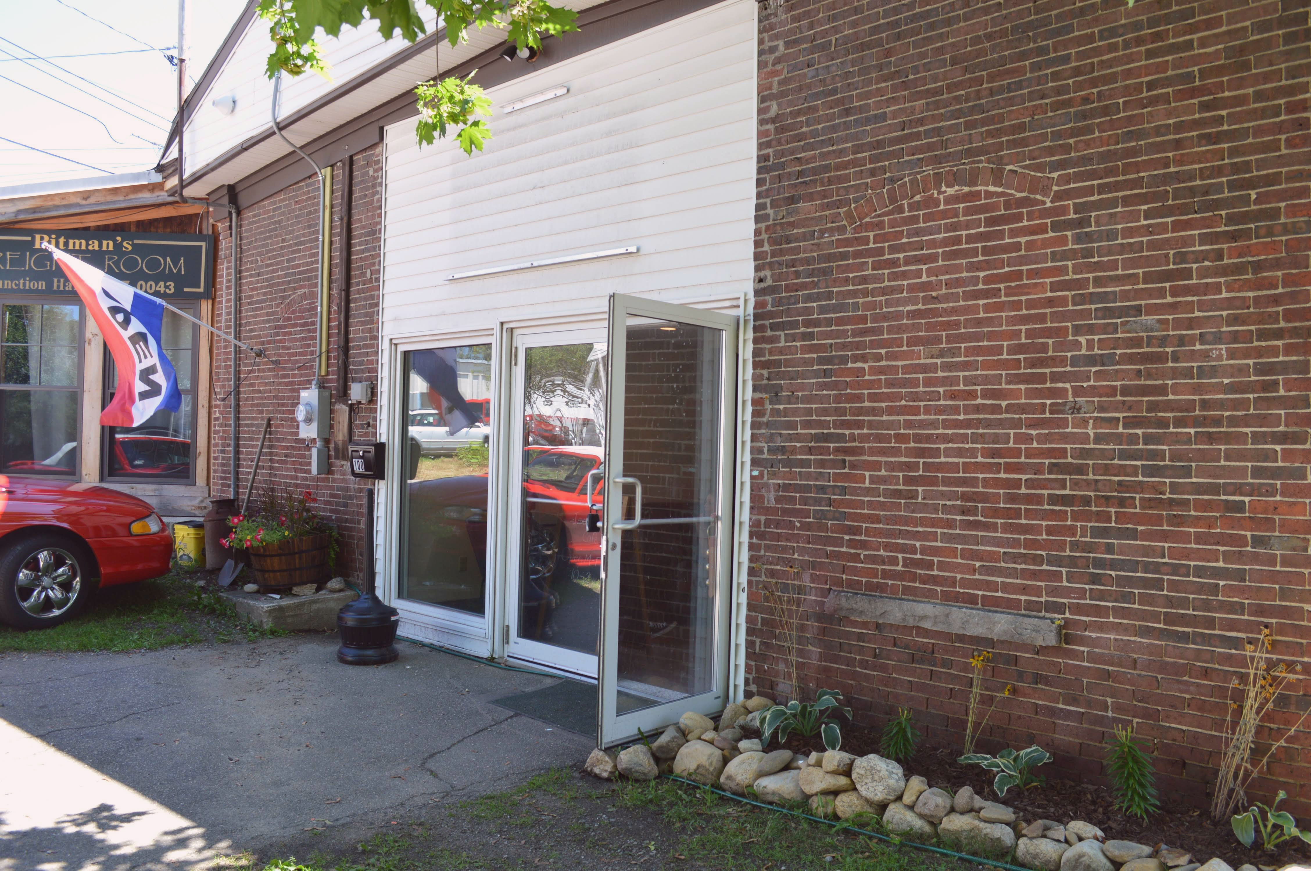 Front of I-61 with open flag, and front door open.